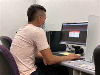 Student taking test in test center.